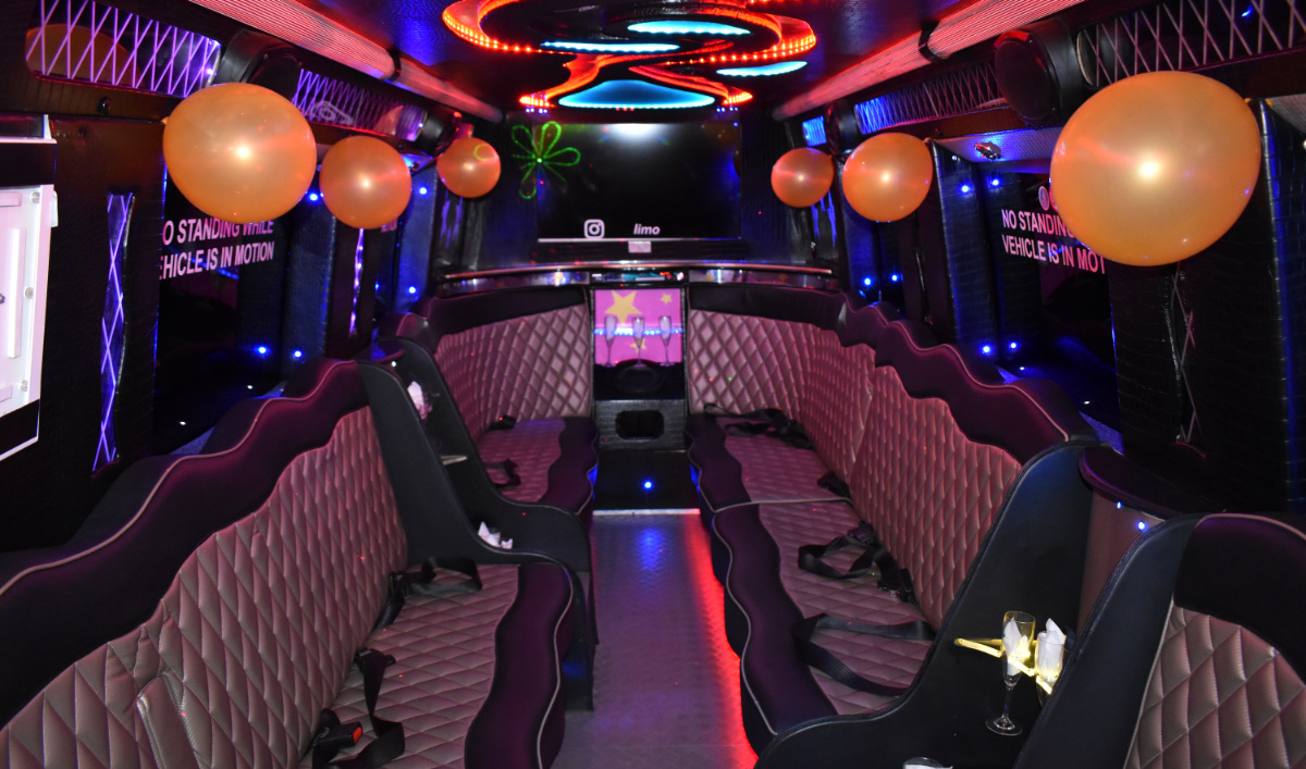 Interior view of 'Starfleet' Cand Apple party bus passenger cabin with disco lights and seating