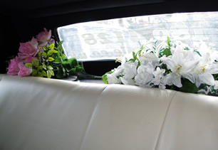 Colour flowers on display on rear shelf of car